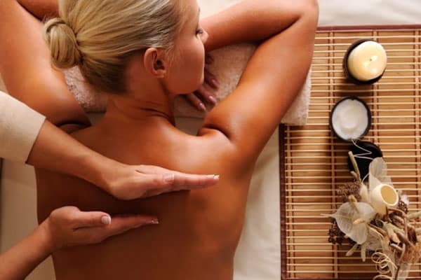 nakshatri girl in black shirt helping another person with strecthing